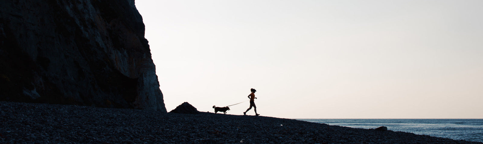 Allie Bailey running with her dog Pickle. Photo by David Miller